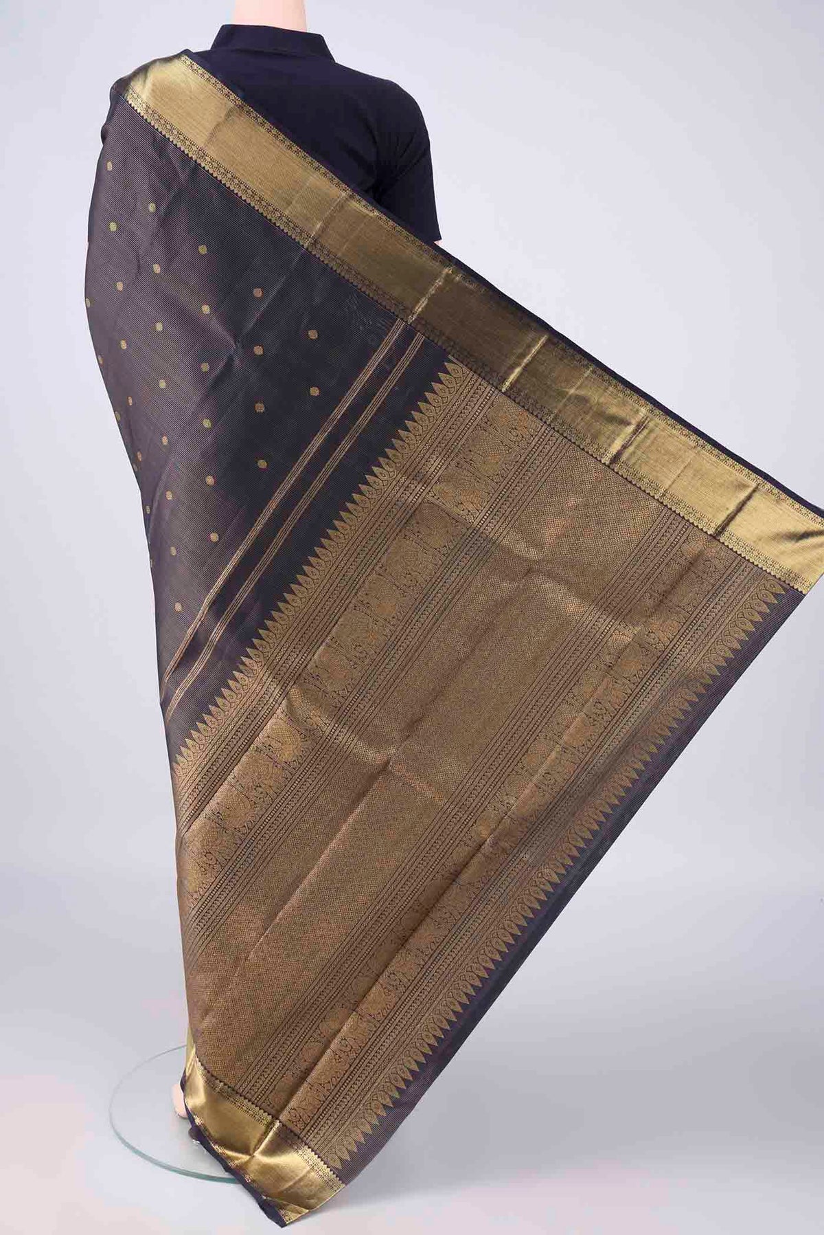Flat view of Pure Silk Pure Zari Navy Blue Kanjivaram Saree with Zari Butta on the body and Zari Border. 