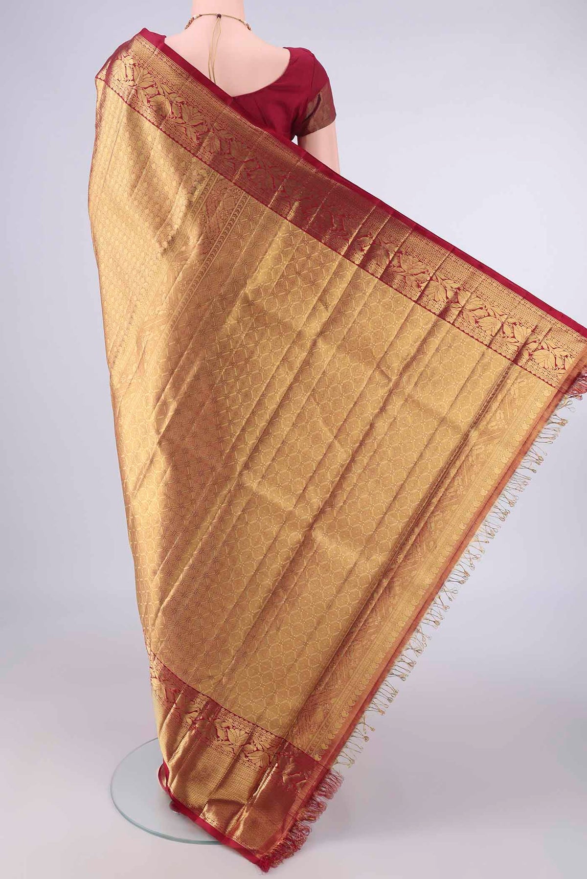 Flat view of Pure Silk Pure Zari Golden Dual Tone Kanjivaram Tissue Saree with Zari Brocade on the body and Zari Border. 