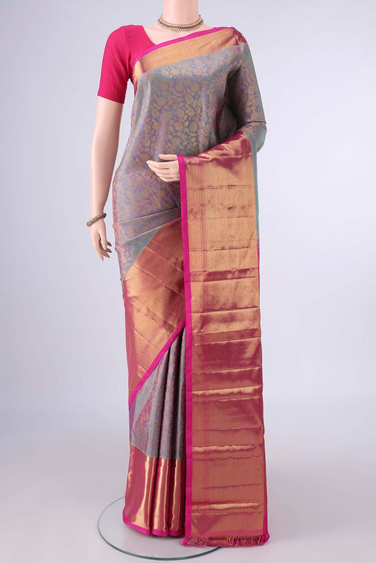 Pure Silk Pure Zari Maya Blue Kanjivaram Saree with Zari Brocade on the body and Zari Border.  displayed on a mannequin
