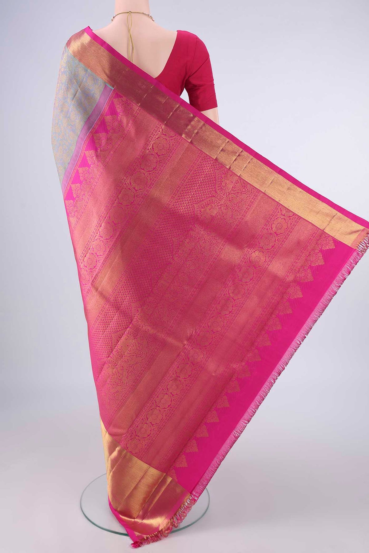 Flat view of Pure Silk Pure Zari Maya Blue Kanjivaram Saree with Zari Brocade on the body and Zari Border. 