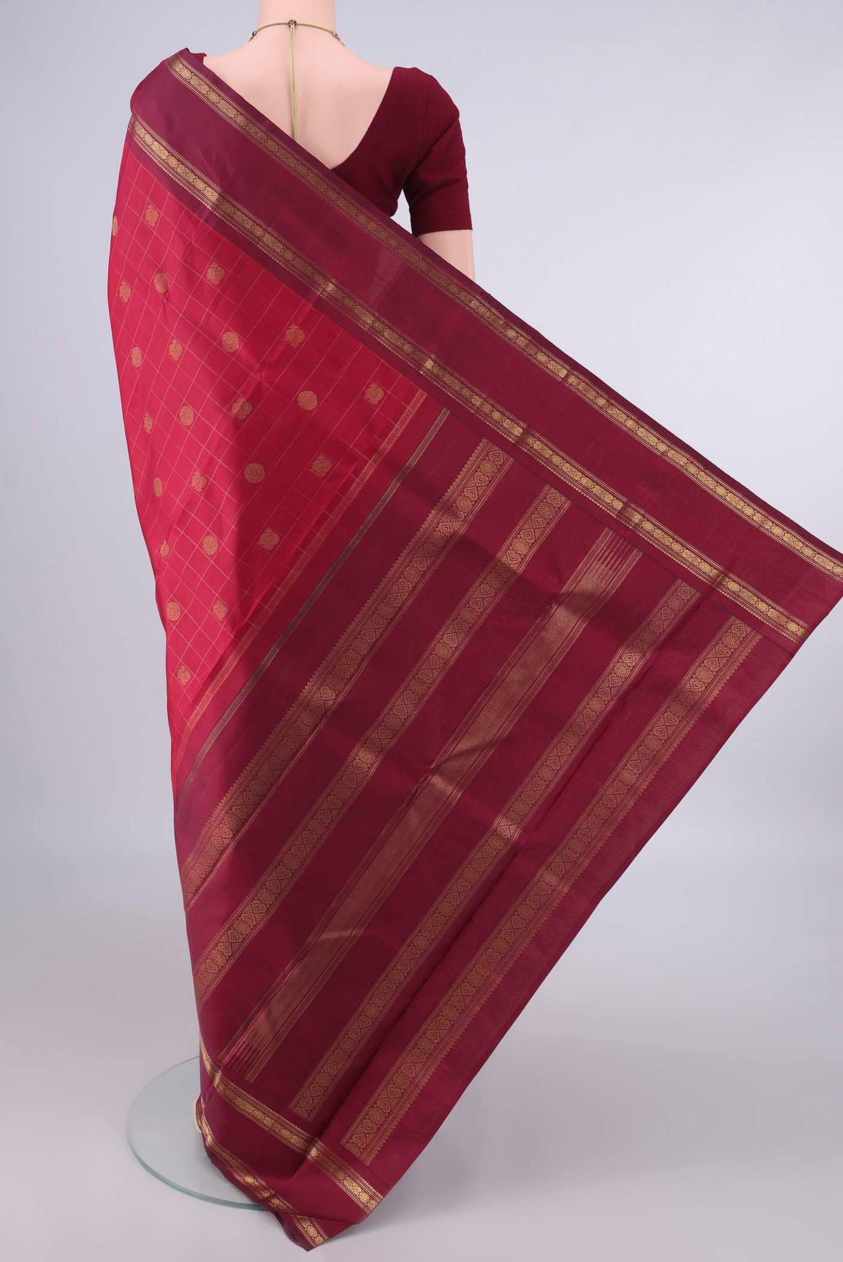 Flat view of Pure Silk Pure Zari Maroon Kanchipuram Saree with Checked design on the body and Thin Zari Line. 