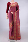 Pure Silk Pure Zari Mauve Kanjivaram Saree with Zari And Thread Butta on the body and Zari And Thread Border.  displayed on a mannequin