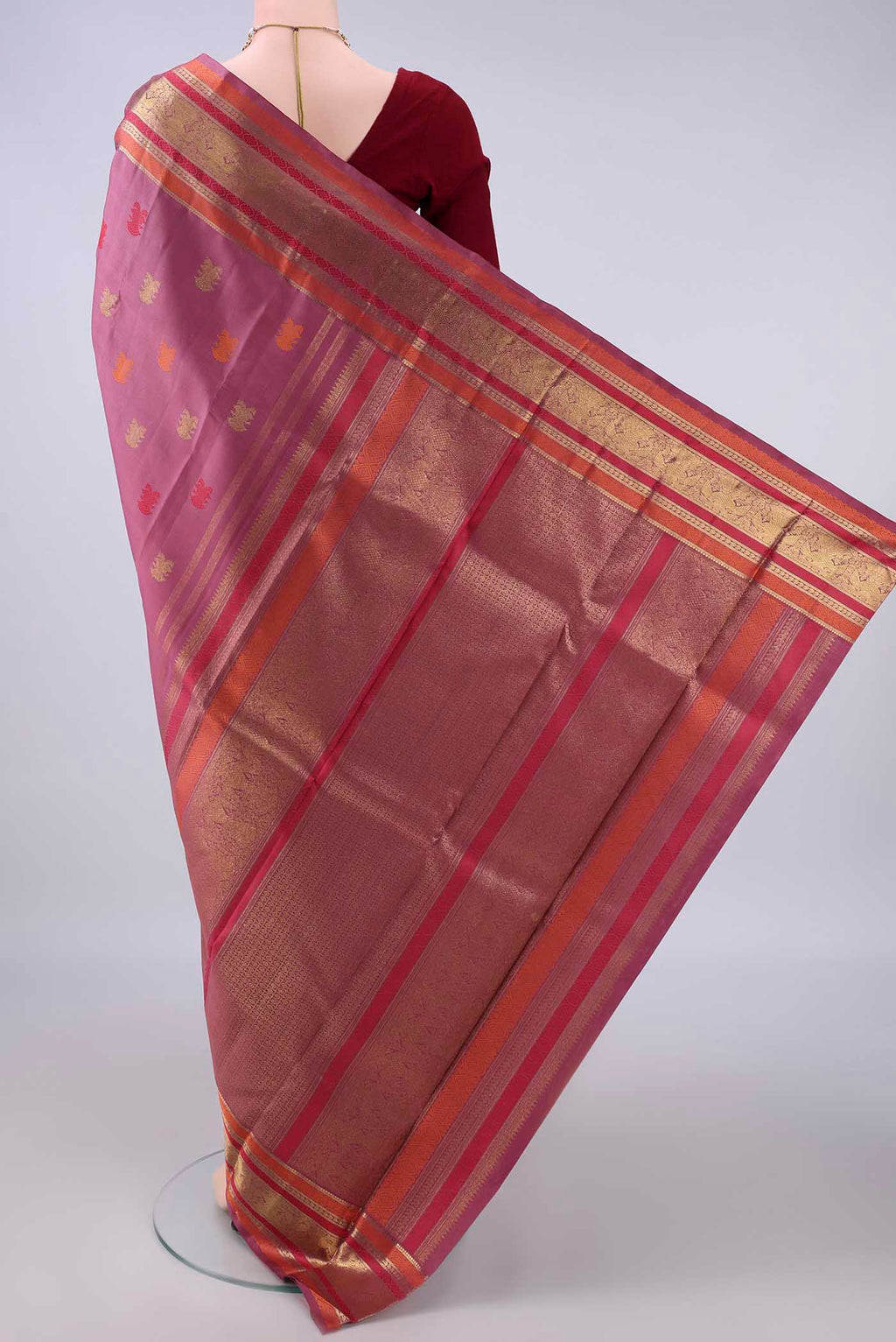 Flat view of Pure Silk Pure Zari Mauve Kanjivaram Saree with Zari And Thread Butta on the body and Zari And Thread Border. 