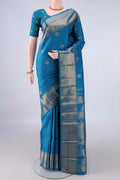 Pure Silk Pure Zari Blue Kanjivaram Saree with Zari Butta on the body and Zari Border.  displayed on a mannequin