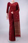 Pure Silk Pure Zari Maroon Kanchipuram Saree with Zari Butta on the body and Thin Zari Line.  displayed on a mannequin