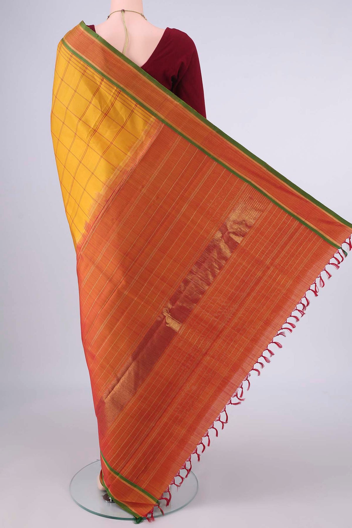 Flat view of Pure Silk Mustard Kanjivaram Saree with Checked design on the body and Zari Border. 