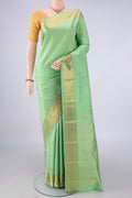 Pure Silk Pure Zari Pista Green Kanjivaram Saree with Zari Butta on the body and Zari Border.  displayed on a mannequin