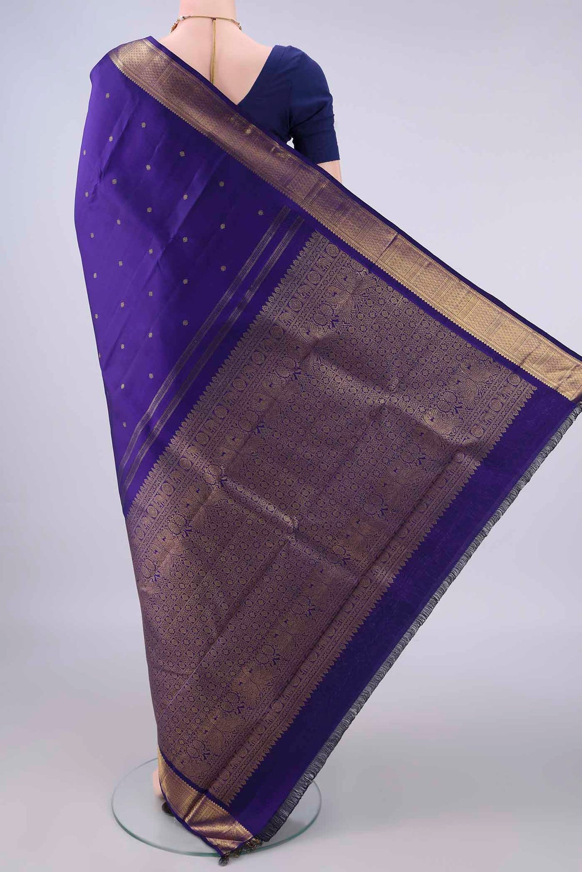 Flat view of Pure Silk Pure Zari Violet Kanjivaram Saree with Zari Butta on the body and Zari Border. 