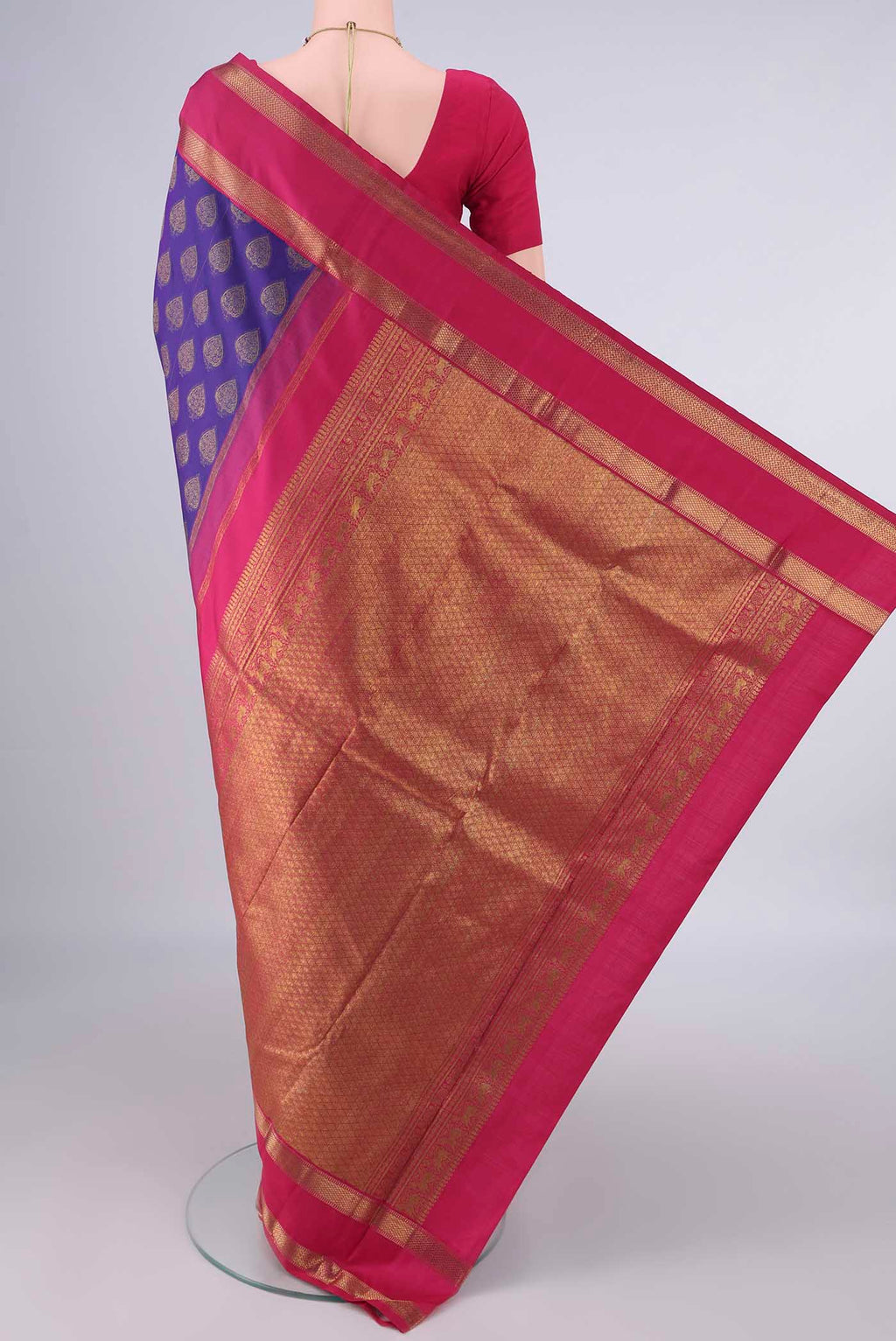 Flat view of Pure Silk Blue Kanjivaram Saree with Zari Butta on the body and Zari Border. 