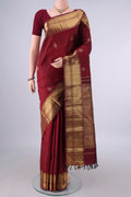 Pure Silk Pure Zari Maroon Kanjivaram Saree with Jacquard With Zari Butta on the body and Zari Border.  displayed on a mannequin