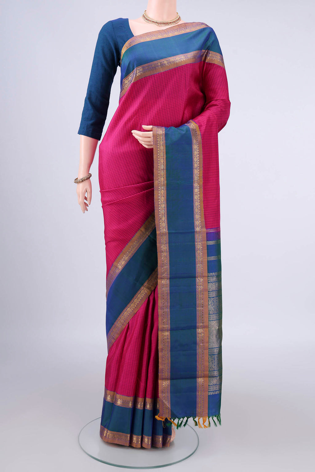 Pure Silk Rani Pink Kanjivaram Saree with Checked design on the body and Zari Border.  displayed on a mannequin