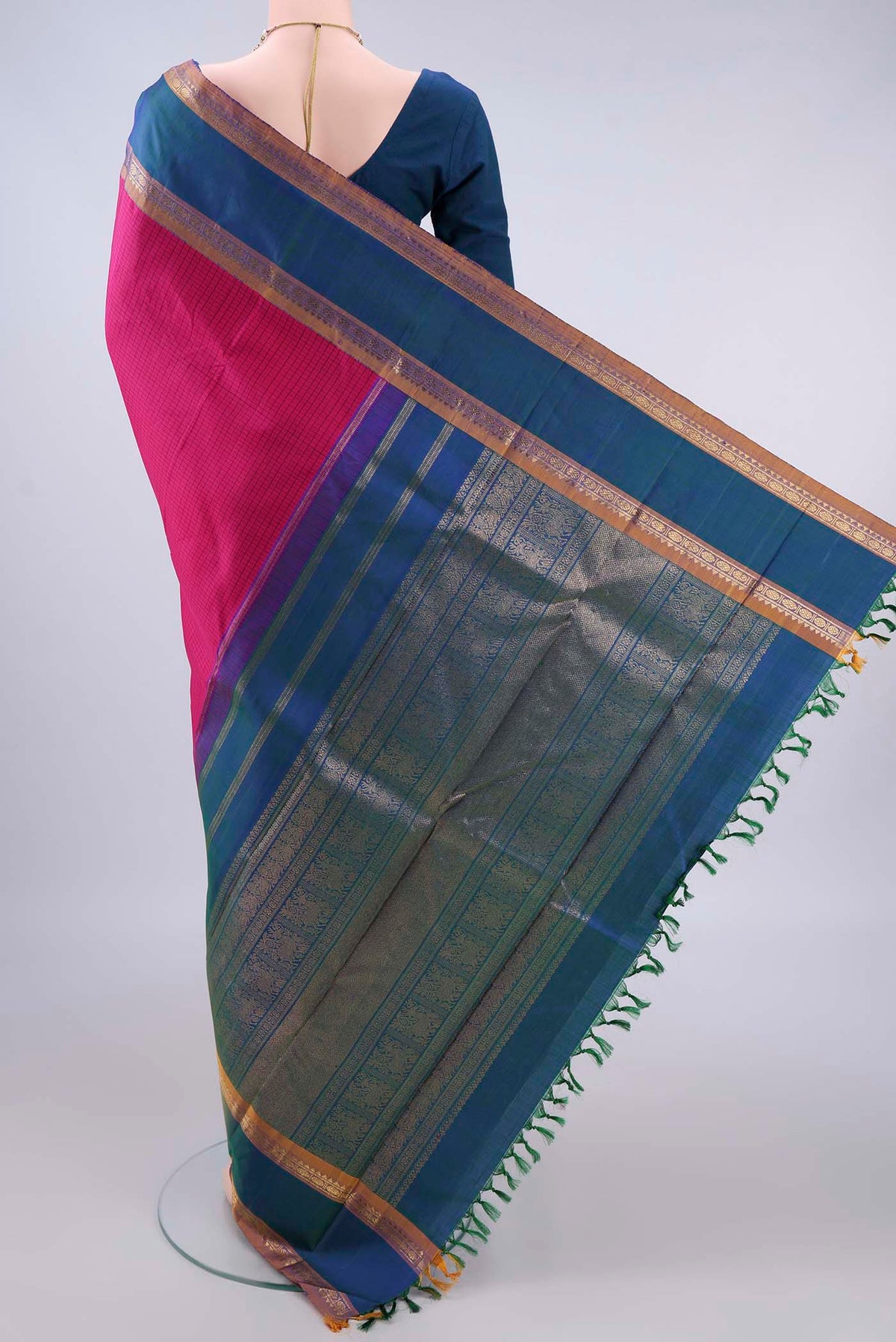 Flat view of Pure Silk Rani Pink Kanjivaram Saree with Checked design on the body and Zari Border. 