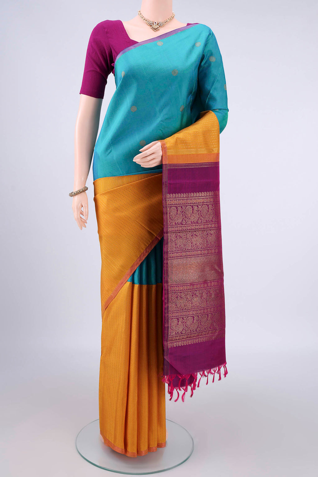 Pure Silk Pure Zari Multi Color Kanjivaram Saree with Half And Half on the body and Plain Border.  displayed on a mannequin