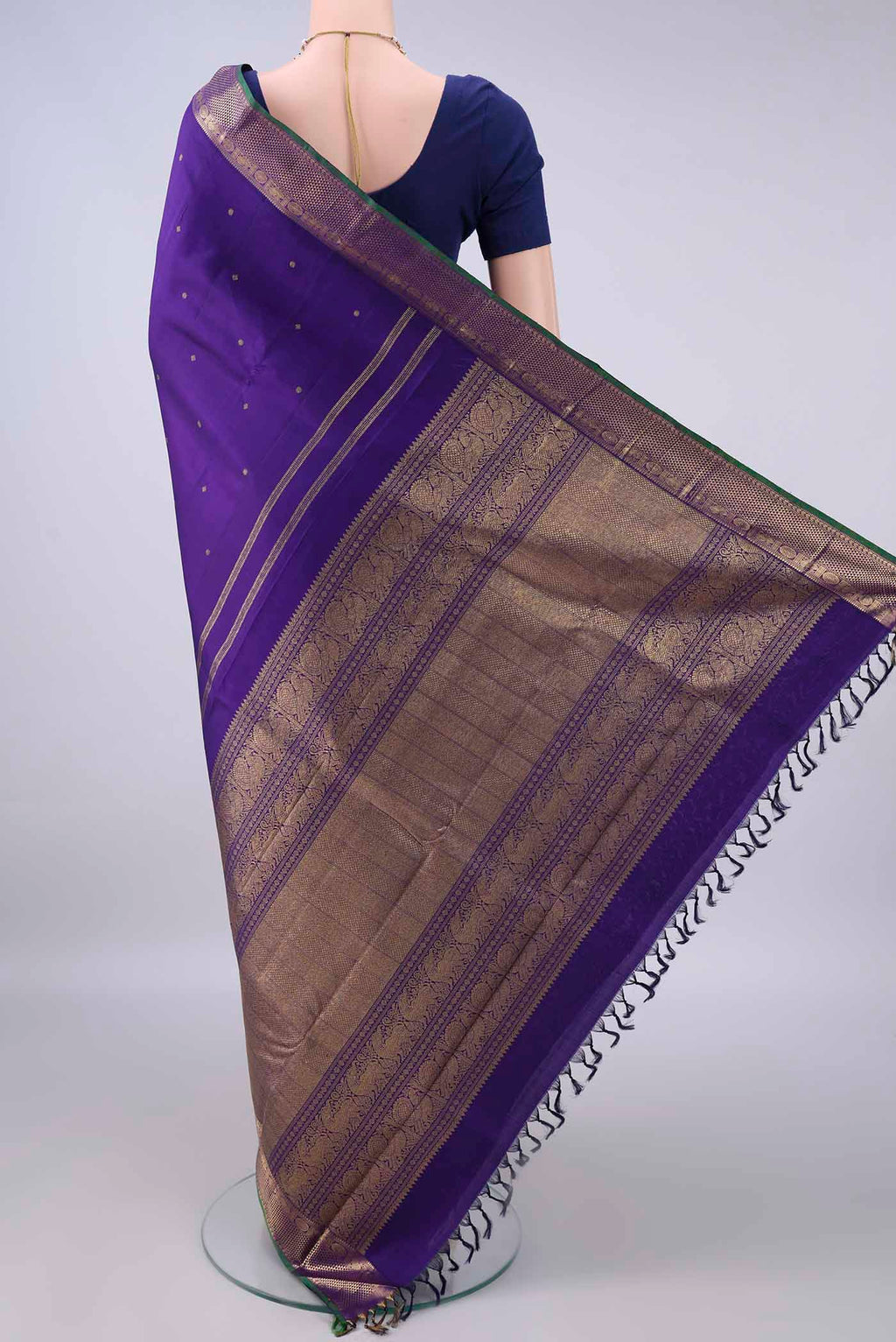 Flat view of Pure Silk Pure Zari Violet Kanjivaram Saree with Zari Butta on the body and Zari Border. 