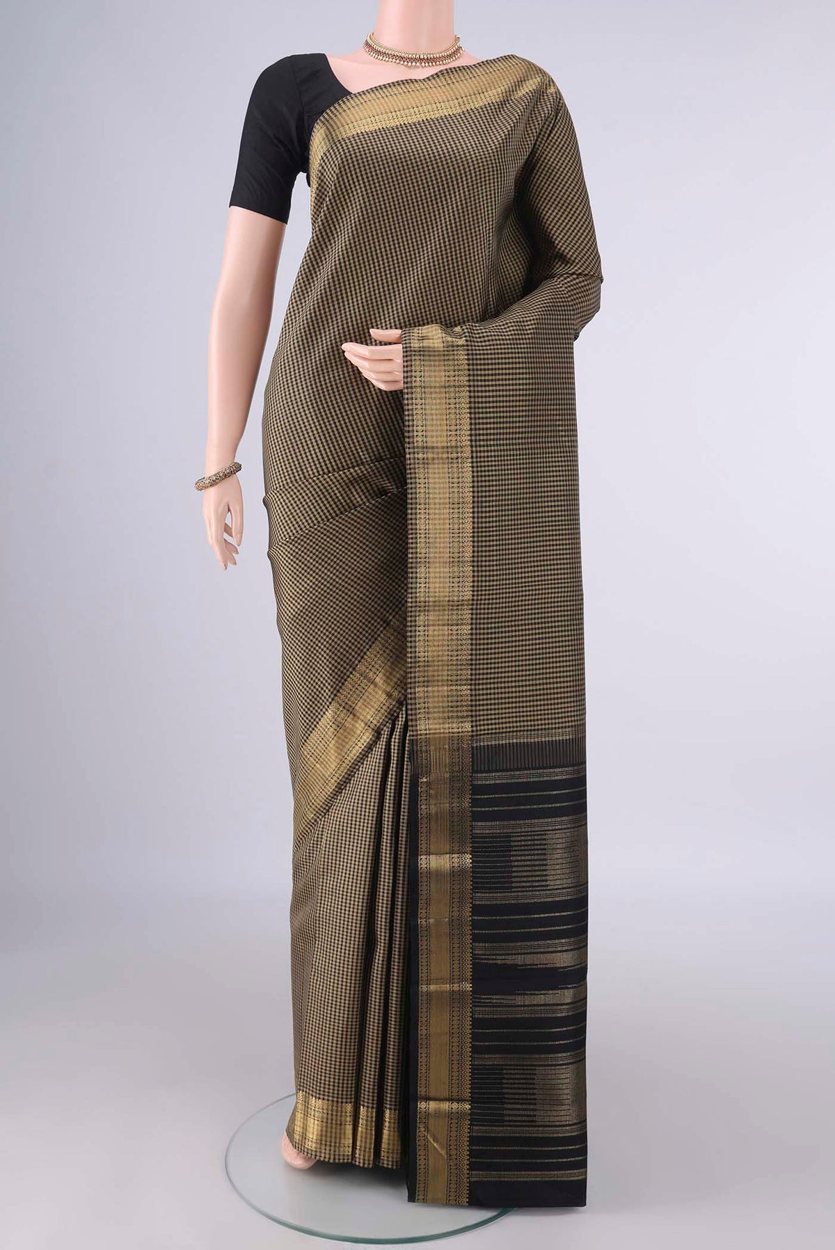 Pure Silk Multi Color Kanjivaram Saree with Checked design on the body and Zari Border.  displayed on a mannequin