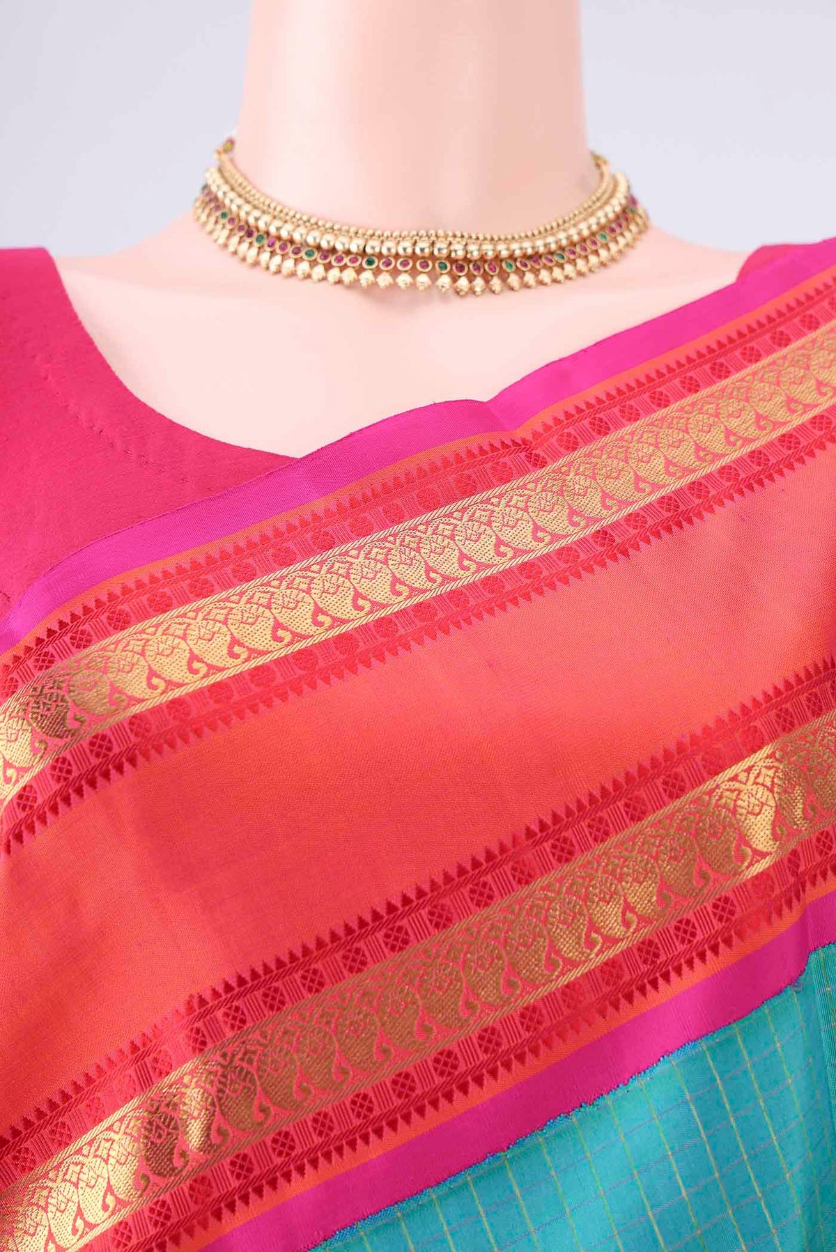 Border image of Pure Silk Pure Zari Turquoise Kanjivaram Saree with Checked design on the body and Thin Zari Line. 