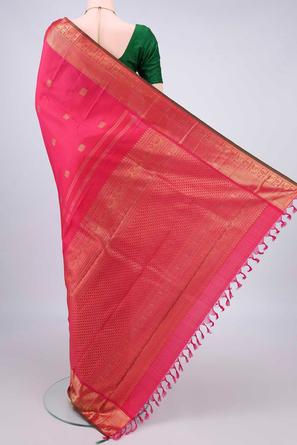 Flat view of Pure Silk Pure Zari Coral Kanjivaram Saree with Zari Butta on the body and Zari Border. 