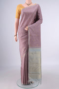 Pure Silk Rose Gold Kanchipuram Saree with Zari Butta on the body and Thin Zari Line.  displayed on a mannequin