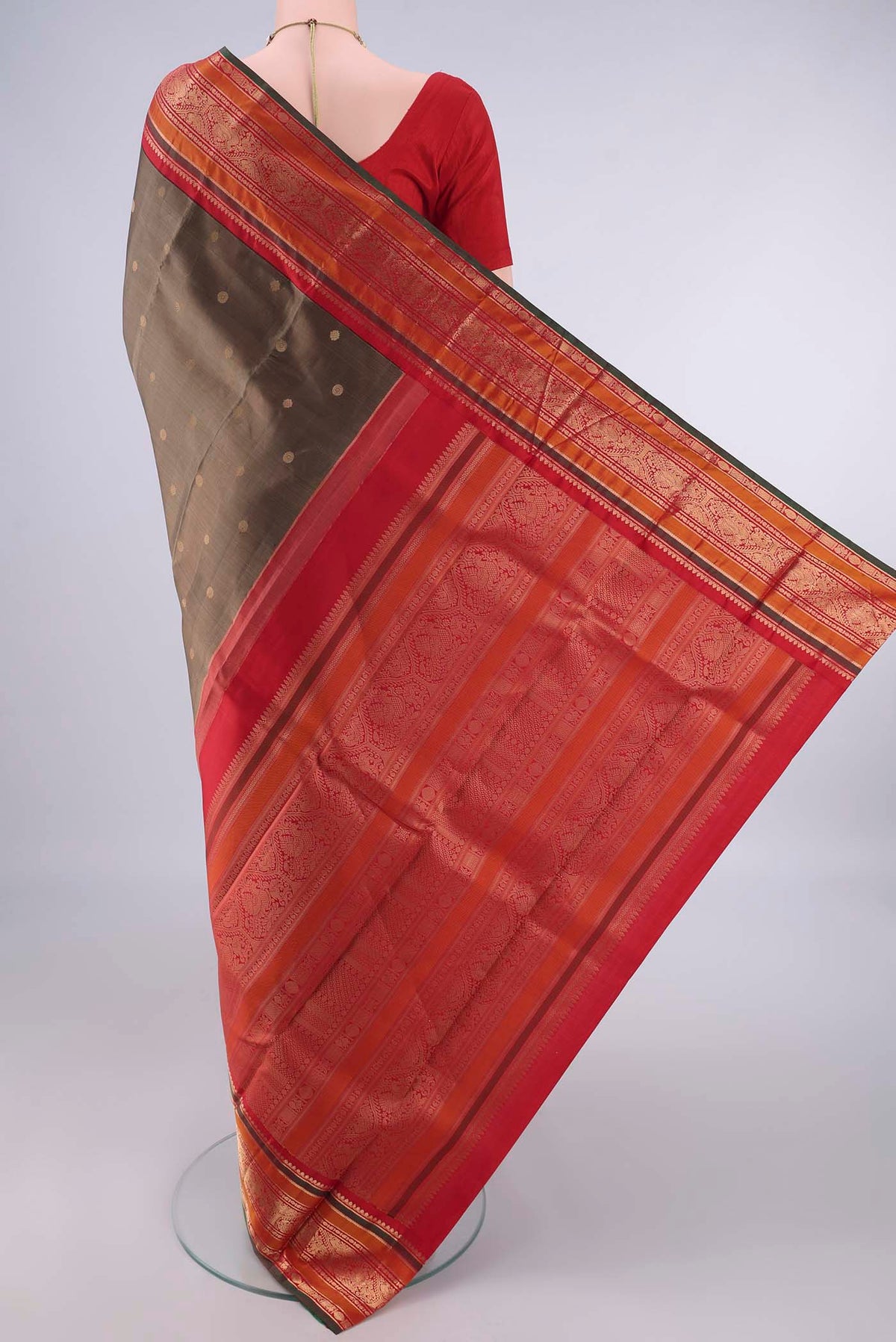 Flat view of Pure Silk Brown Dual Tone Kanjivaram Saree with Zari Butta on the body and Zari Border. 