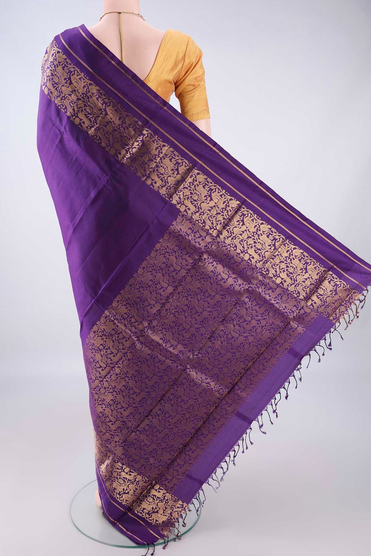 Flat view of Pure Silk Purple Kanchipuram Saree with Plain Body and Zari Border. 