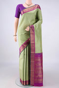 Pure Silk Pure Zari Pista Green Kanjivaram Saree with Zari Butta on the body and Zari Border.  displayed on a mannequin