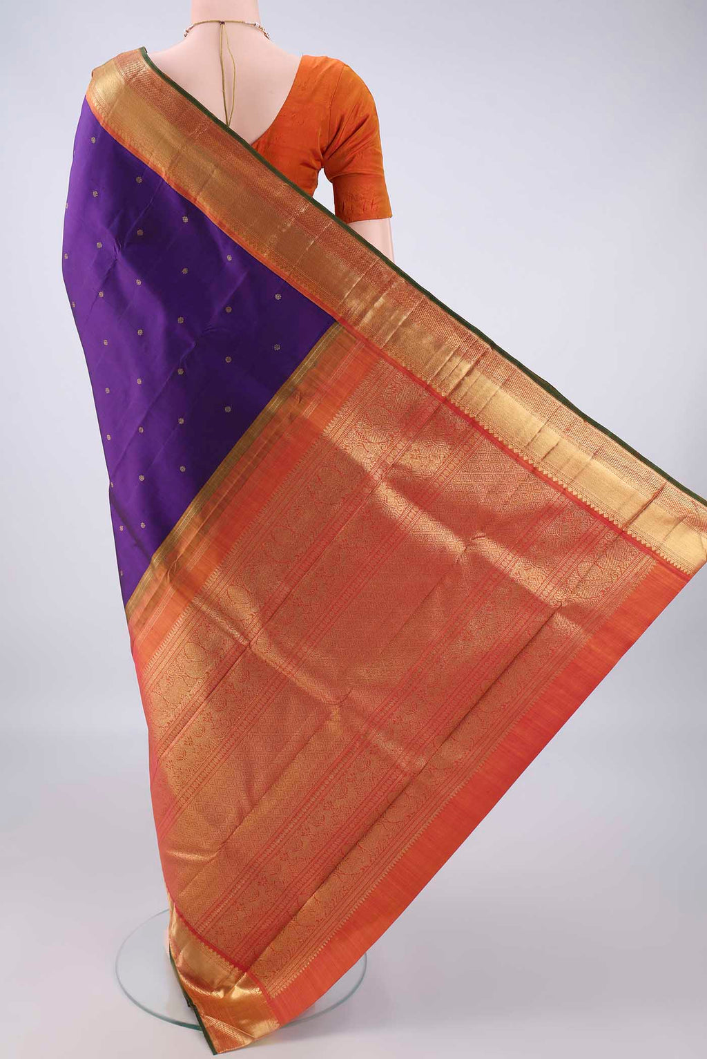 Flat view of Pure Silk Pure Zari Purple Kanjivaram Saree with Zari Butta on the body and Zari Border. 
