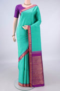 Pure Silk Pure Zari Sea Green Kanjivaram Saree with Zari Butta on the body and Zari Border.  displayed on a mannequin