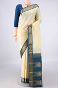 Pure Silk Pure Zari Cream Kanjivaram Saree with Zari Butta on the body and Zari Border.  displayed on a mannequin