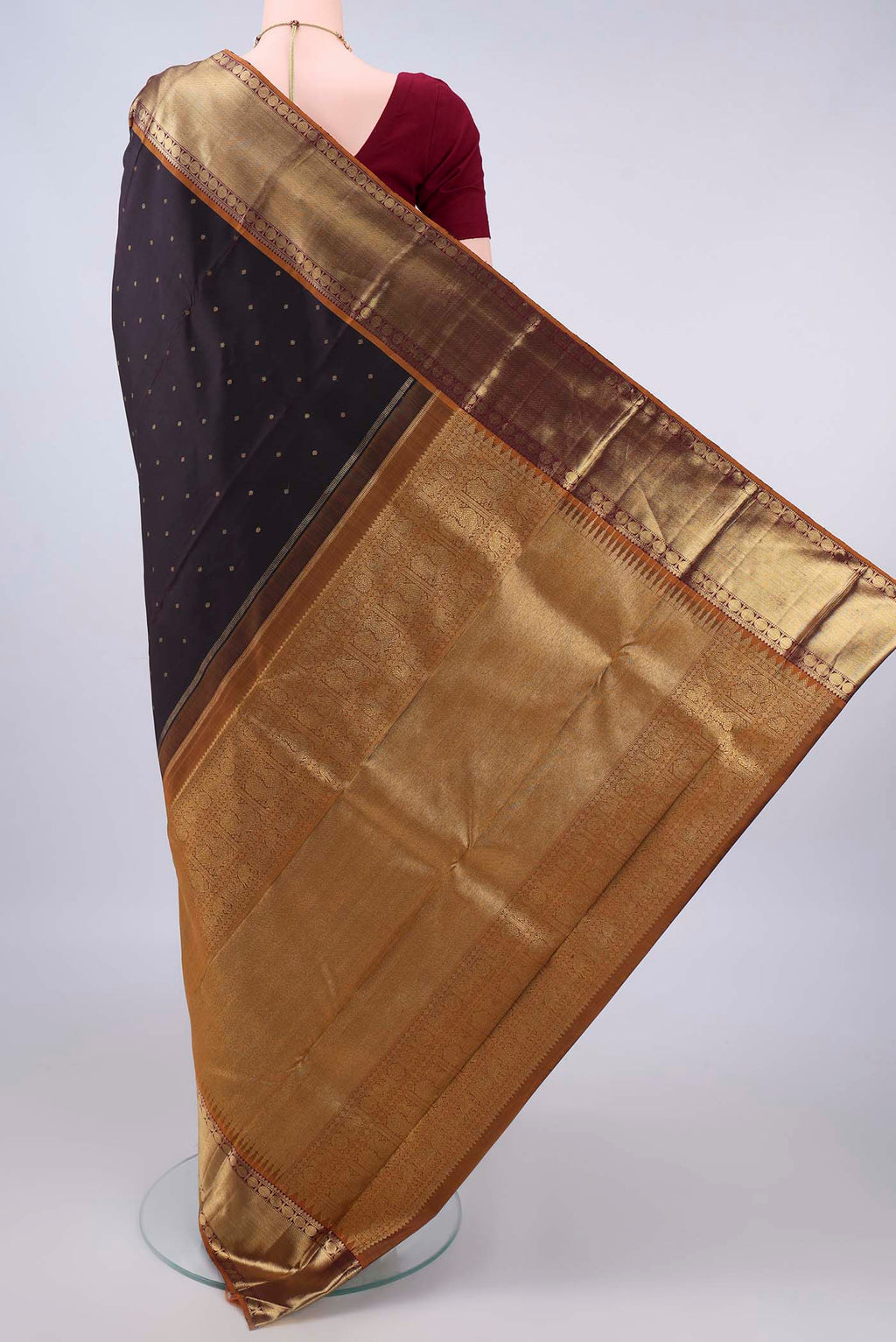 Flat view of Pure Silk Pure Zari Coffee Brown Kanjivaram Saree with Zari Butta on the body and Zari Border. 