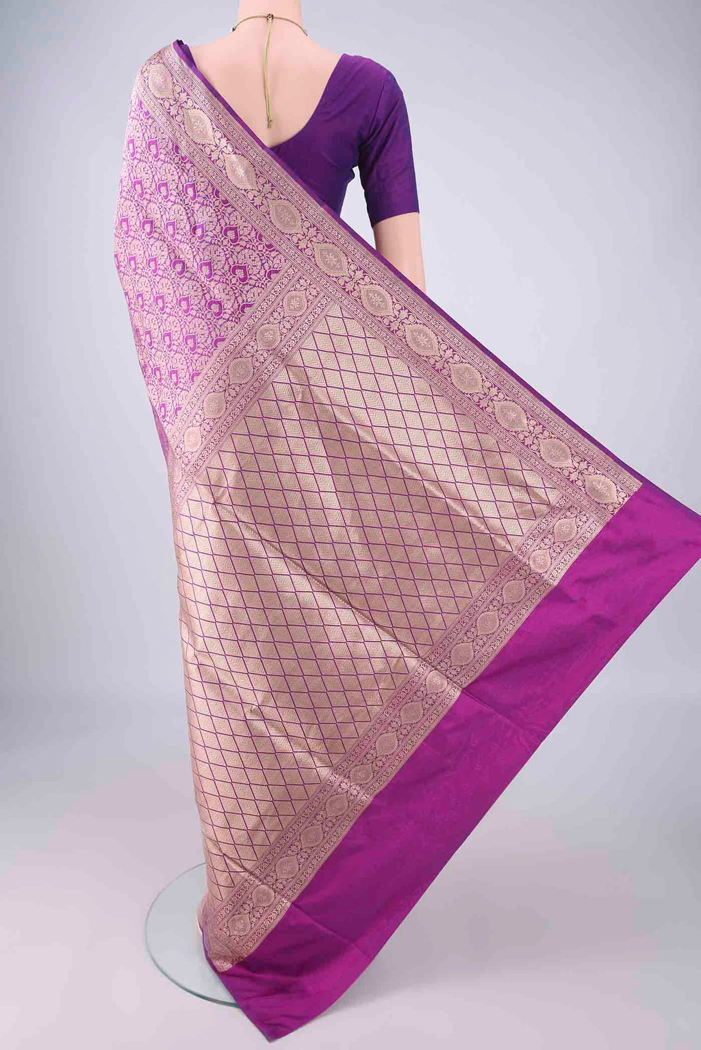 Flat view of Purple Banarasi Silk Saree with Zari Brocade on the body and Zari Border. 