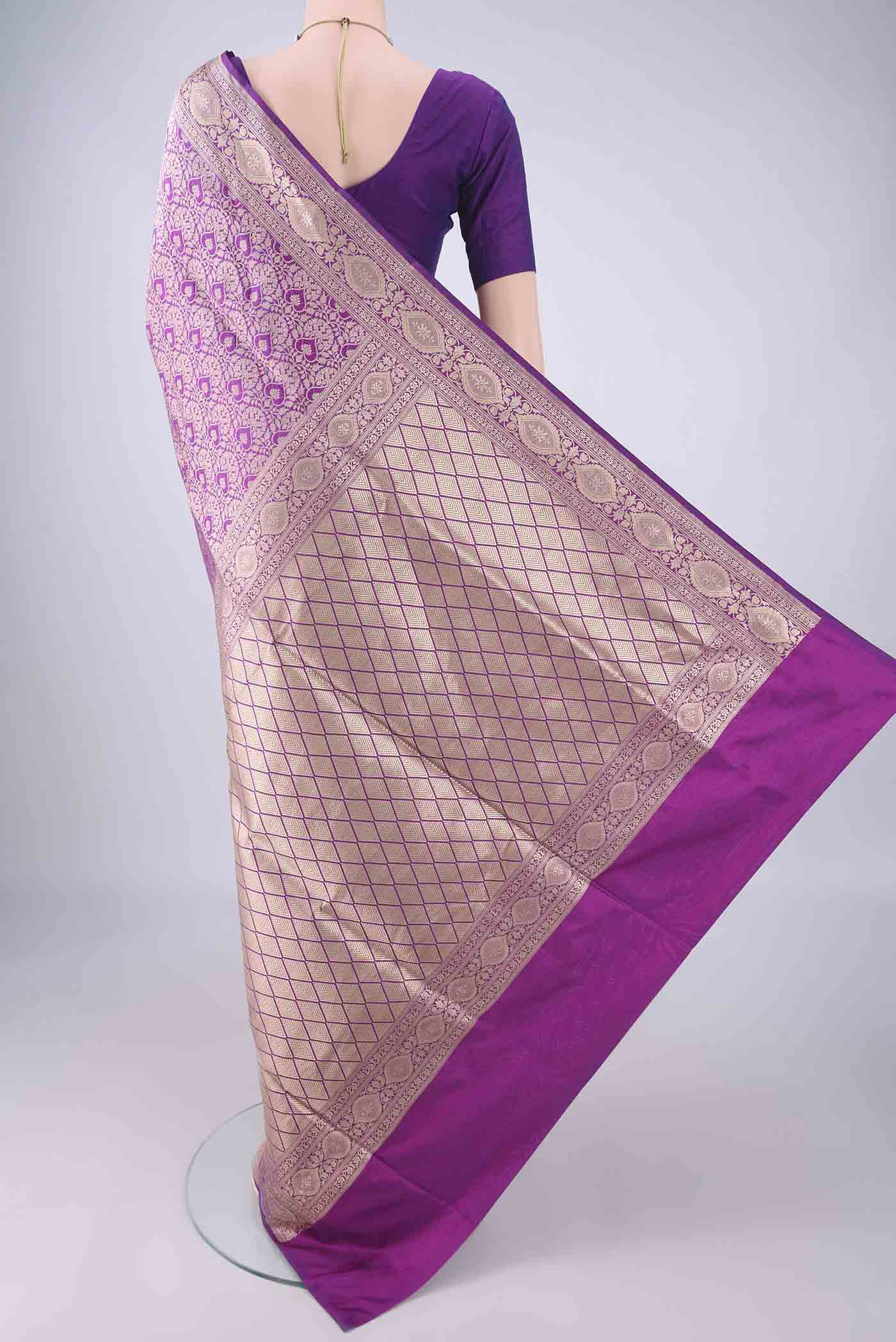 Flat view of Purple Banarasi Silk Saree with Zari Brocade on the body and Zari Border. 