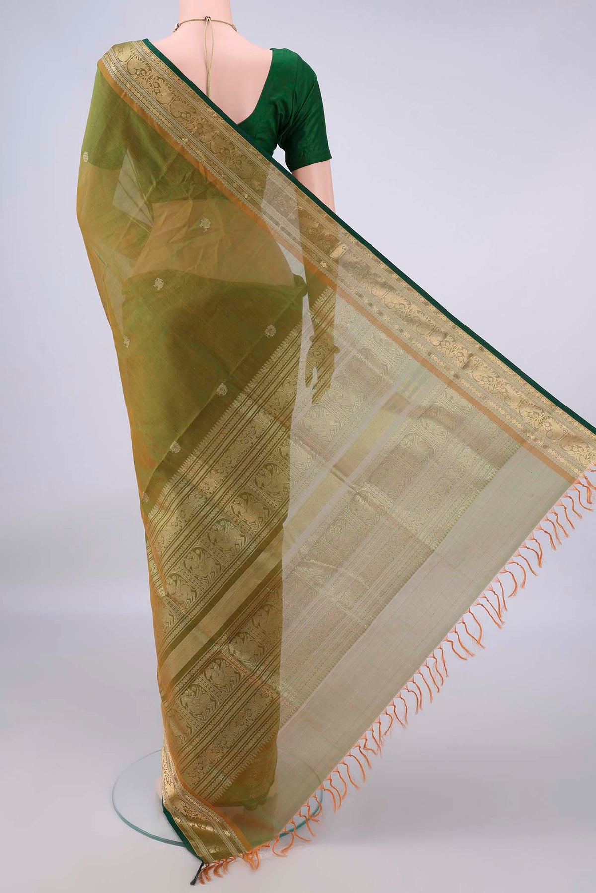 Flat view of Mehandi Green Coimbatore Cotton Saree with Zari Butta on the body and Zari Border. 