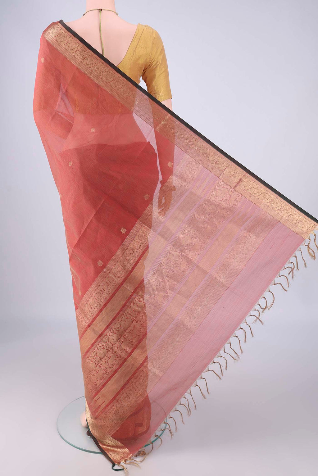 Flat view of Coral Coimbatore Silk Cotton Saree with Zari Butta on the body and Zari Border. 