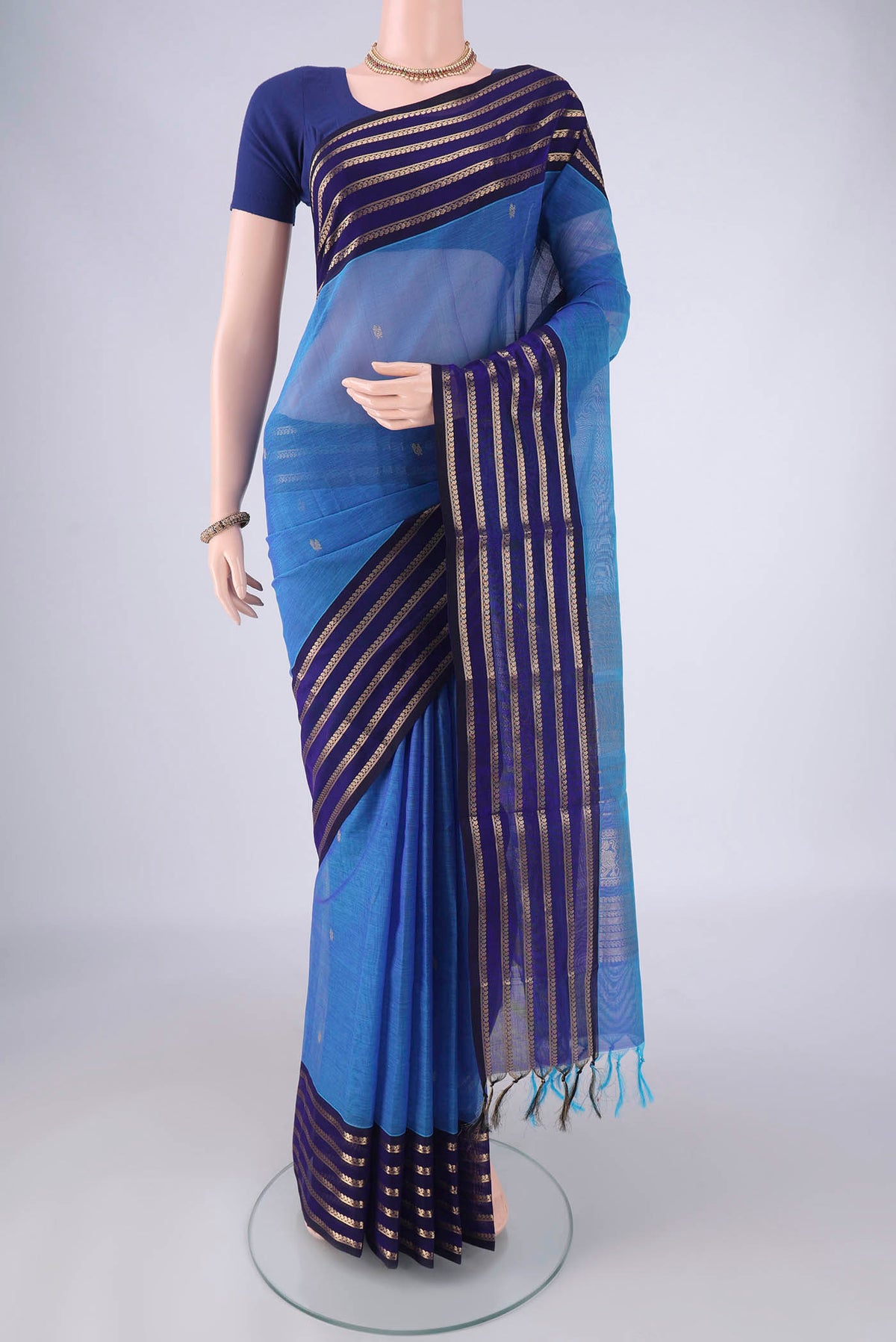 Blue Coimbatore Silk Cotton Saree with Zari Butta on the body and Zari Border.  displayed on a mannequin