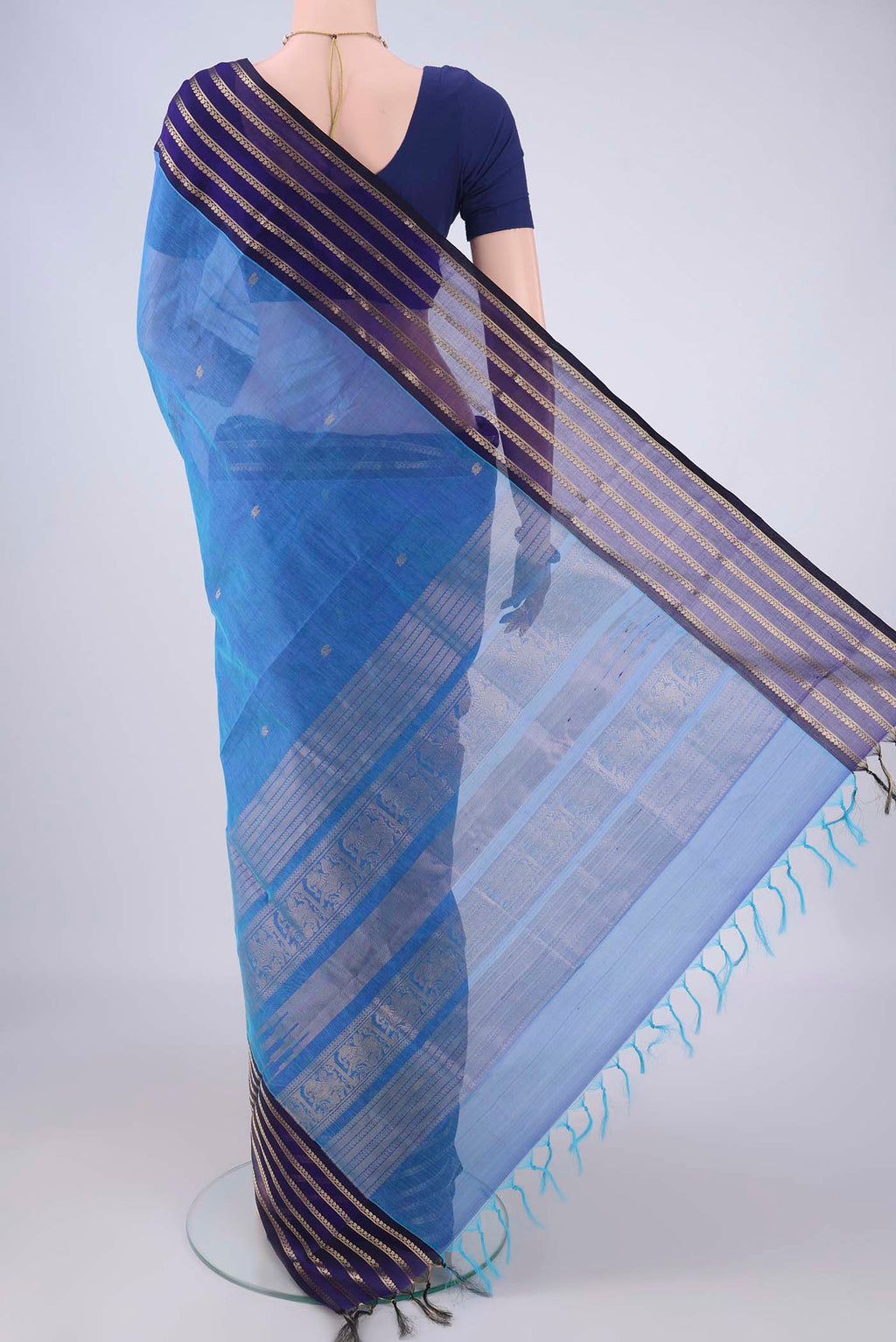 Flat view of Blue Coimbatore Silk Cotton Saree with Zari Butta on the body and Zari Border. 