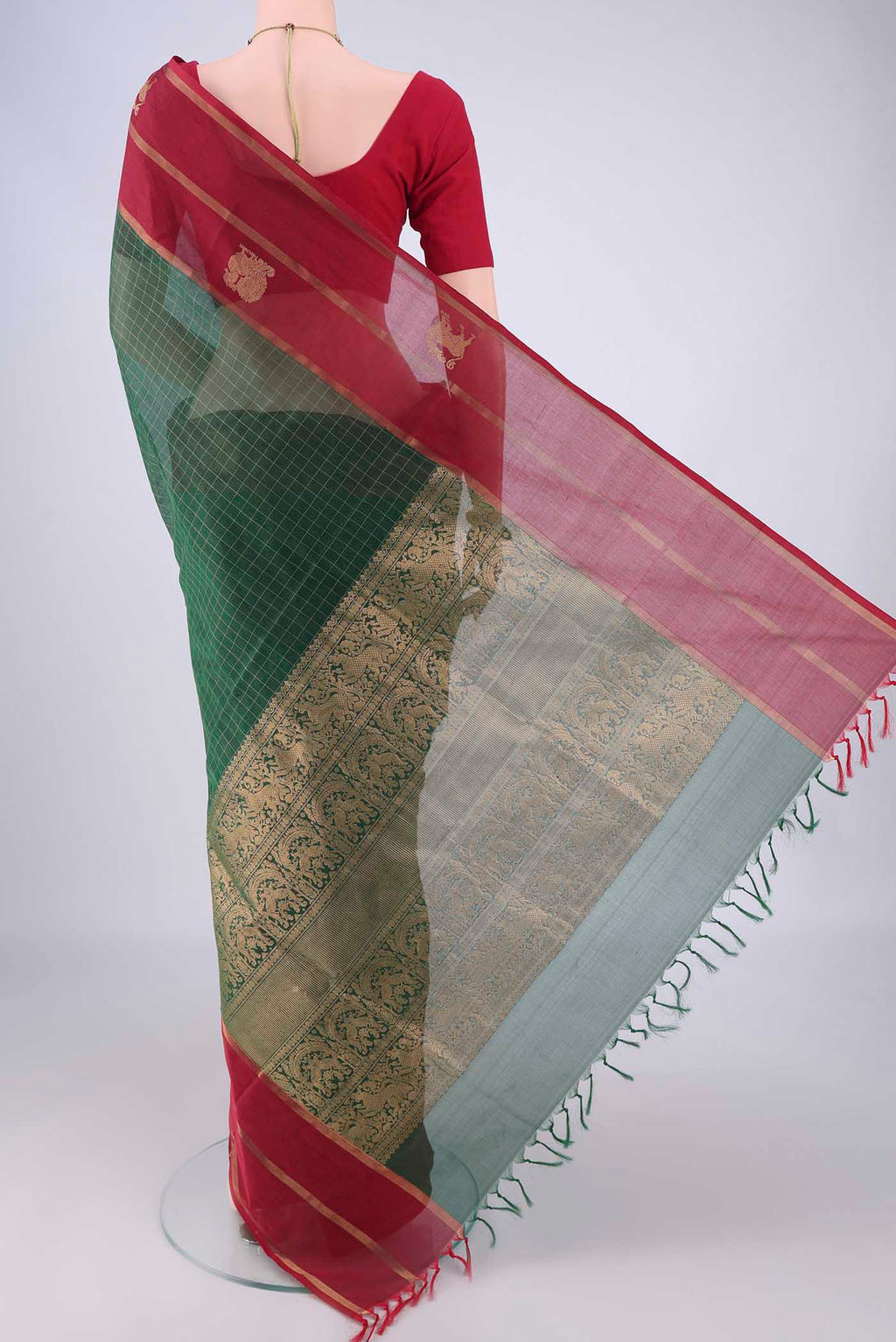 Flat view of Bottle Green Coimbatore Silk Cotton Saree with Checked design on the body and Zari Border. 