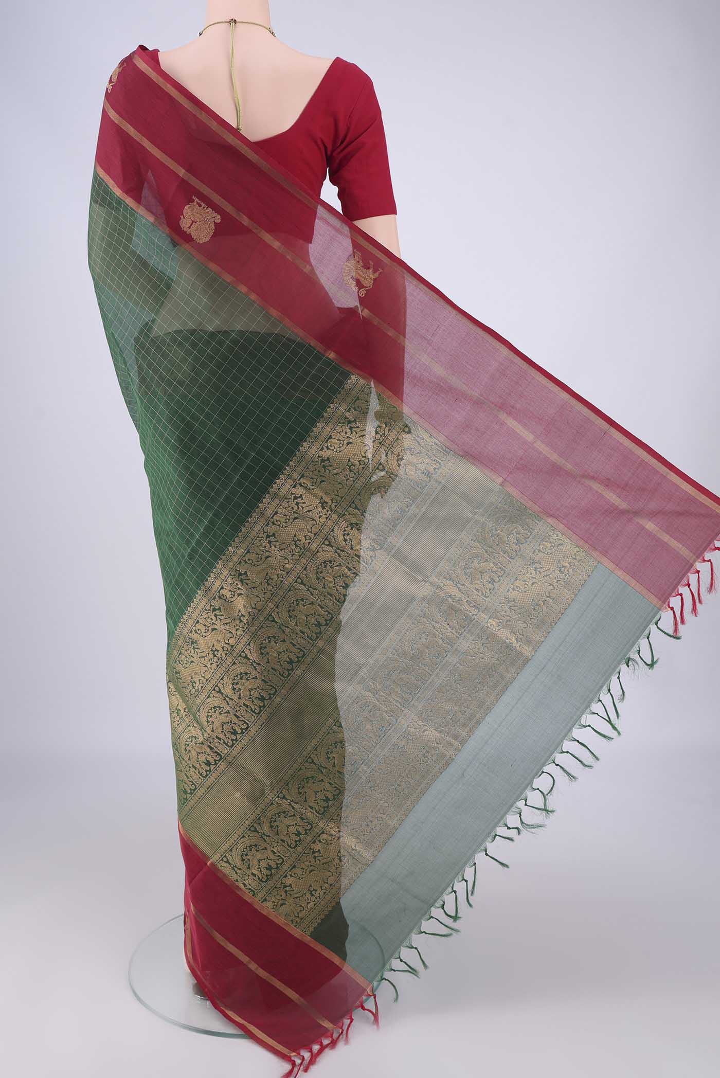 Flat view of Bottle Green Coimbatore Silk Cotton Saree with Checked design on the body and Zari Border. 