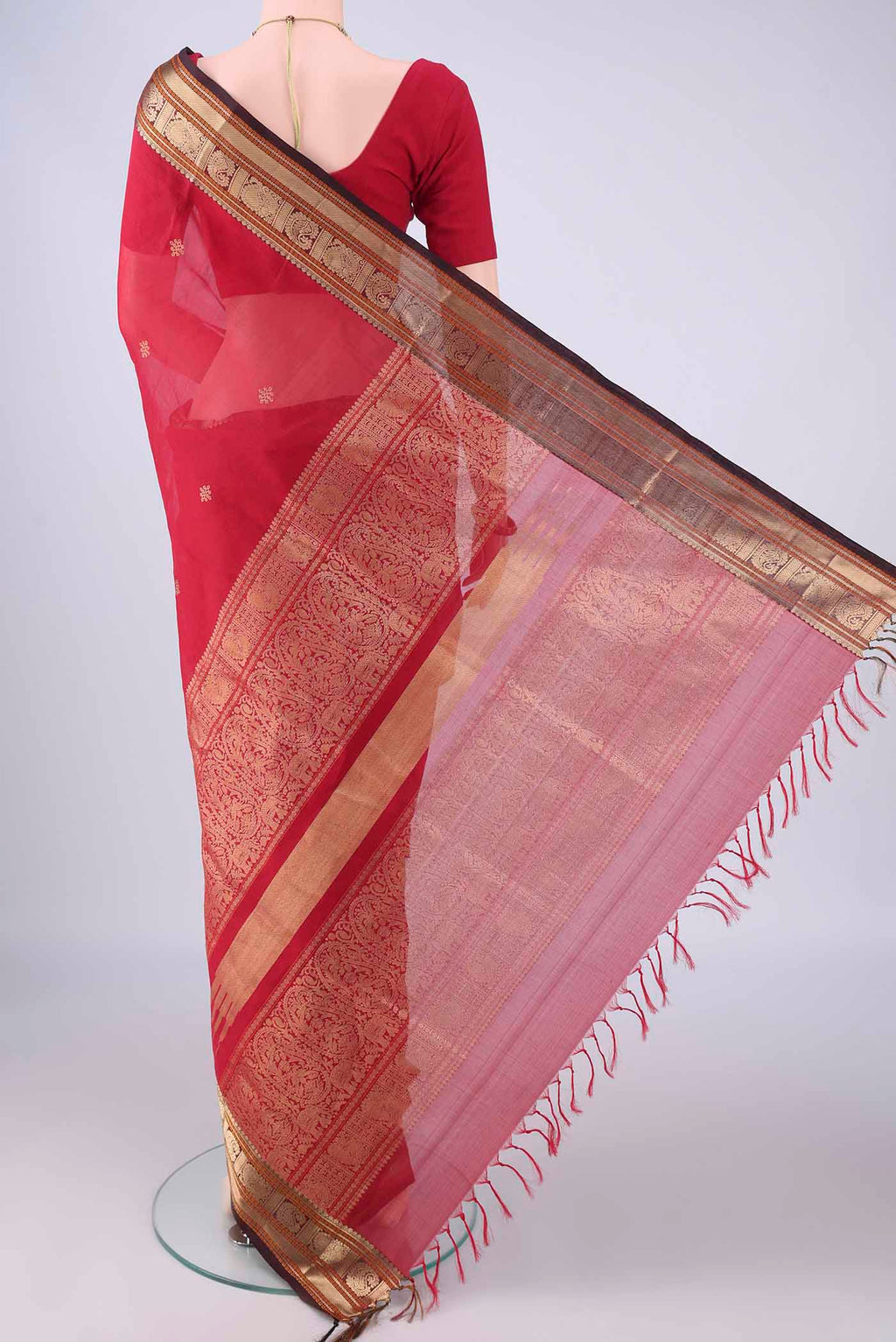 Flat view of Deep Red Coimbatore Silk Cotton Saree with Zari Butta on the body and Zari Border. 