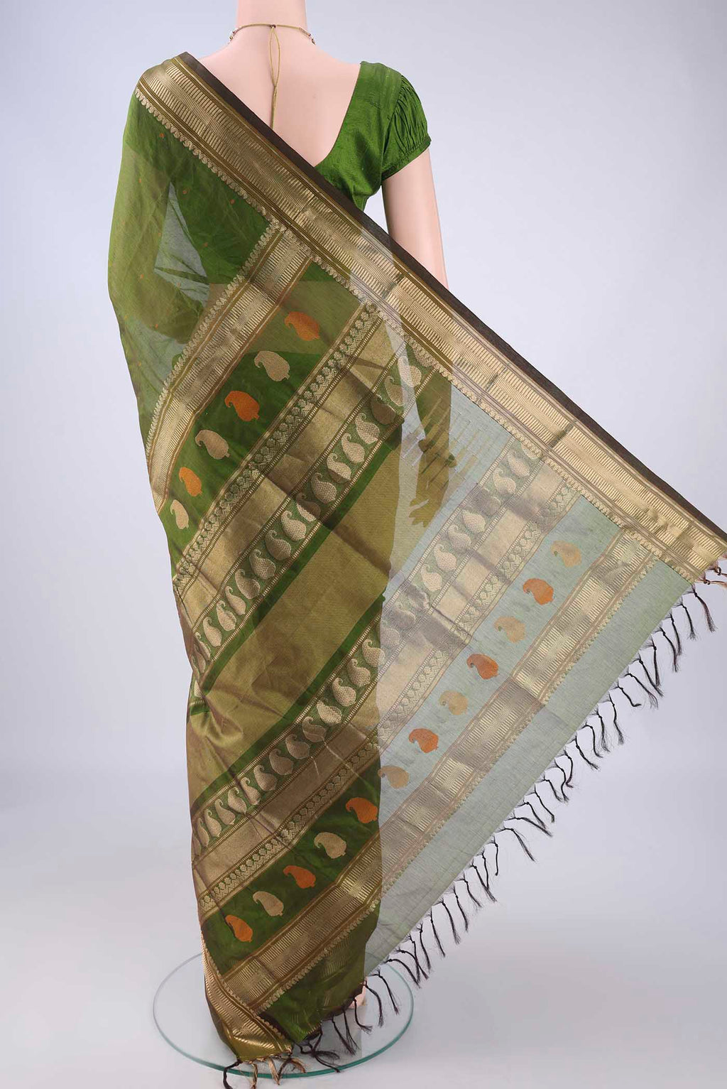 Flat view of Mehandi Green Coimbatore Silk Cotton Saree with Thread Butta on the body and Zari Border. 