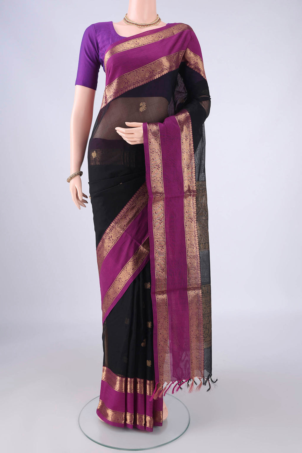 Black Coimbatore Silk Cotton Saree with Zari Butta on the body and Zari Border.  displayed on a mannequin