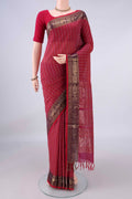 Red Coimbatore Cotton Saree with Checked design on the body and Zari Border.  displayed on a mannequin