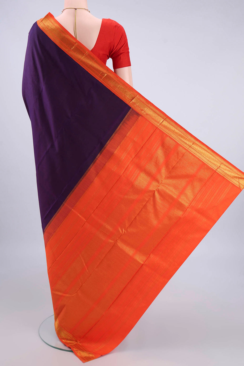 Flat view of Pure Silk Purple Kanjivaram Saree with Plain Body and Zari Border. 
