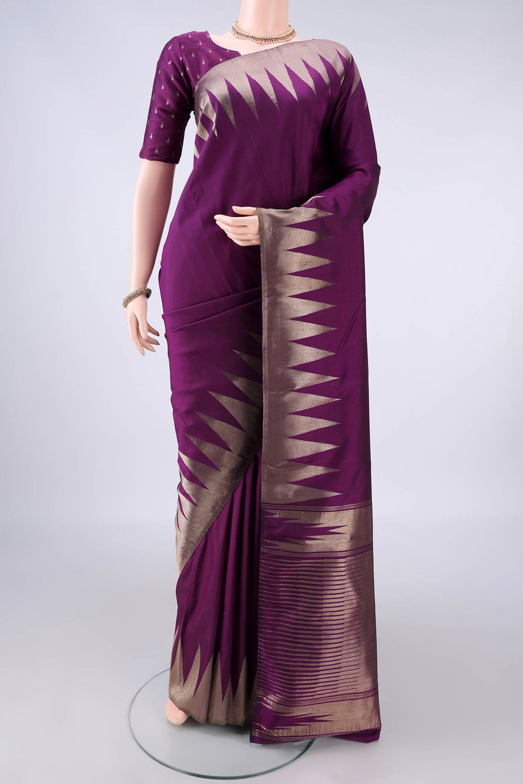 Pure Silk Purple Kanjivaram Saree with Plain Body and Temple Border.  displayed on a mannequin