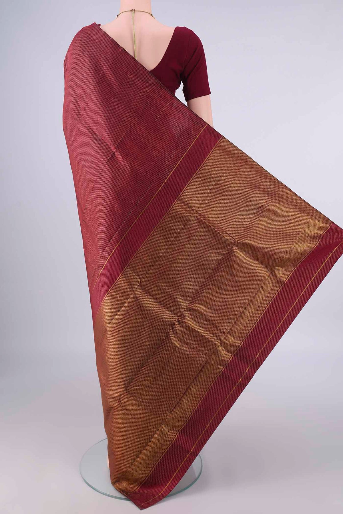 Flat view of Pure Silk Maroon Kanchipuram Saree with Checked design on the body and Without Border. 