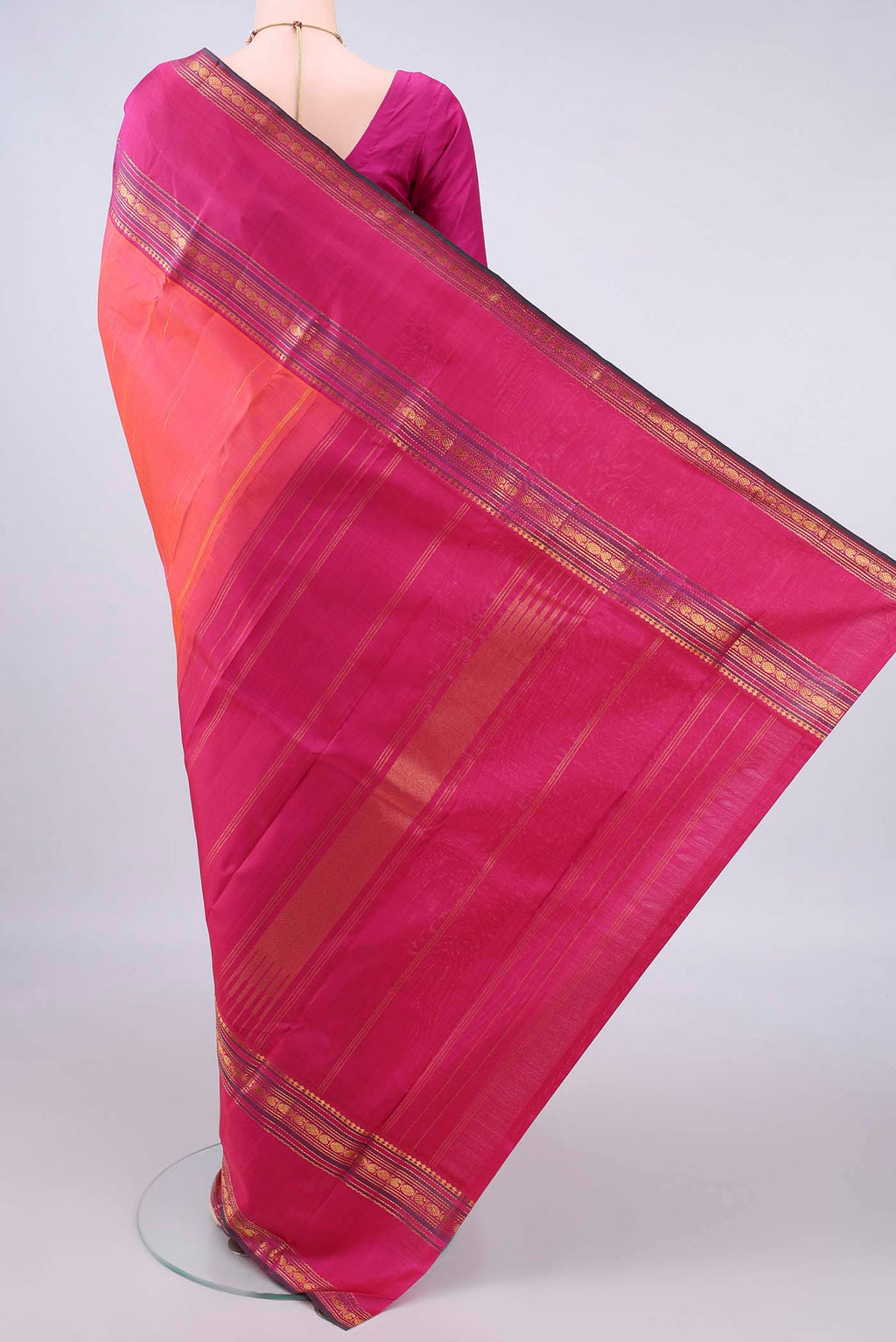 Flat view of Pure Silk Orange Kanjivaram Saree with Zari Butta on the body and Zari Border. 