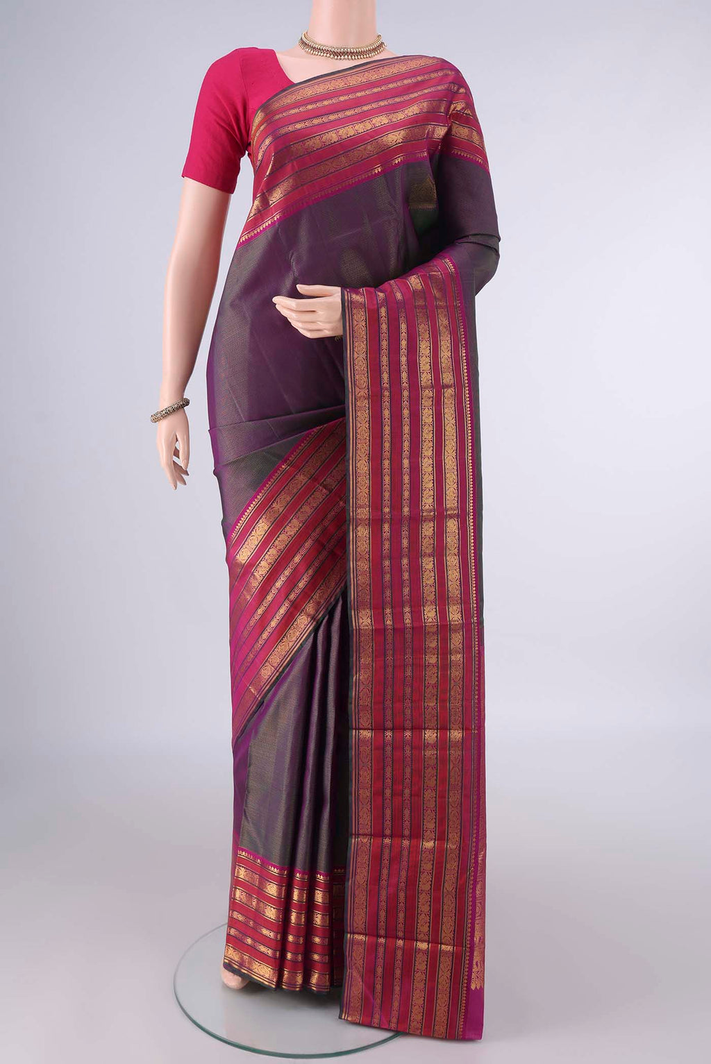 Pure Silk Purple Dual Tone Kanjivaram Saree with Zari Butta on the body and Zari Border.  displayed on a mannequin