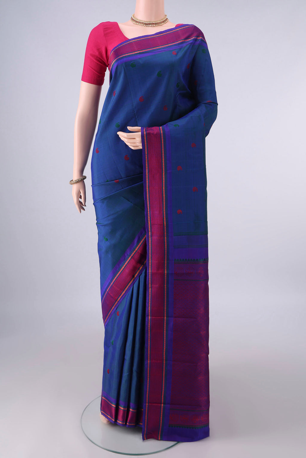 Pure Silk Blue Dual Tone Kanjivaram Saree with Thread Butta on the body and Thread Border.  displayed on a mannequin