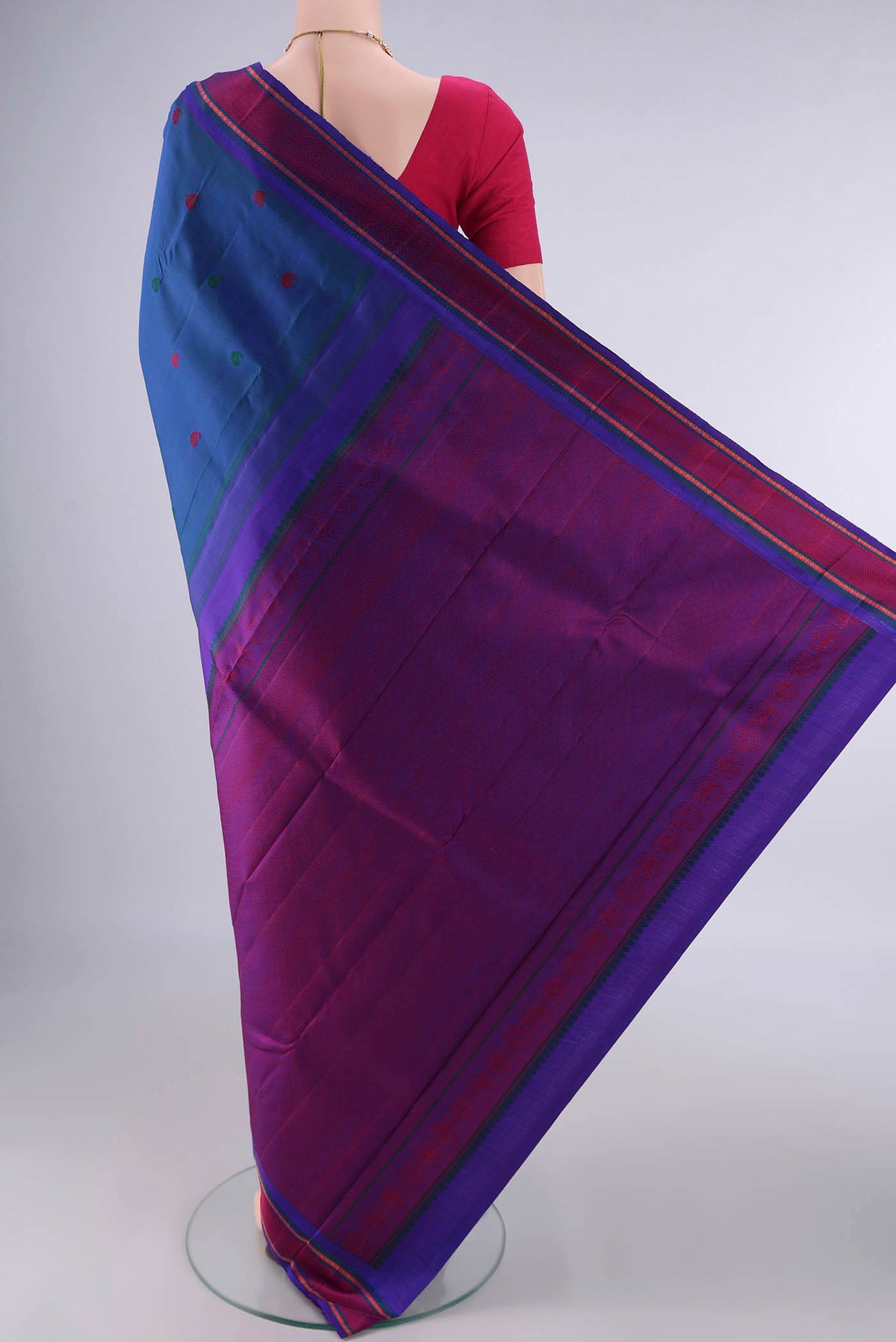 Flat view of Pure Silk Blue Dual Tone Kanjivaram Saree with Thread Butta on the body and Thread Border. 