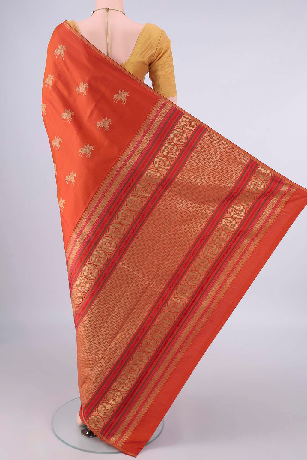 Flat view of Pure Silk Rust Kanjivaram Saree with Thread Butta on the body and Thin Zari Line. 