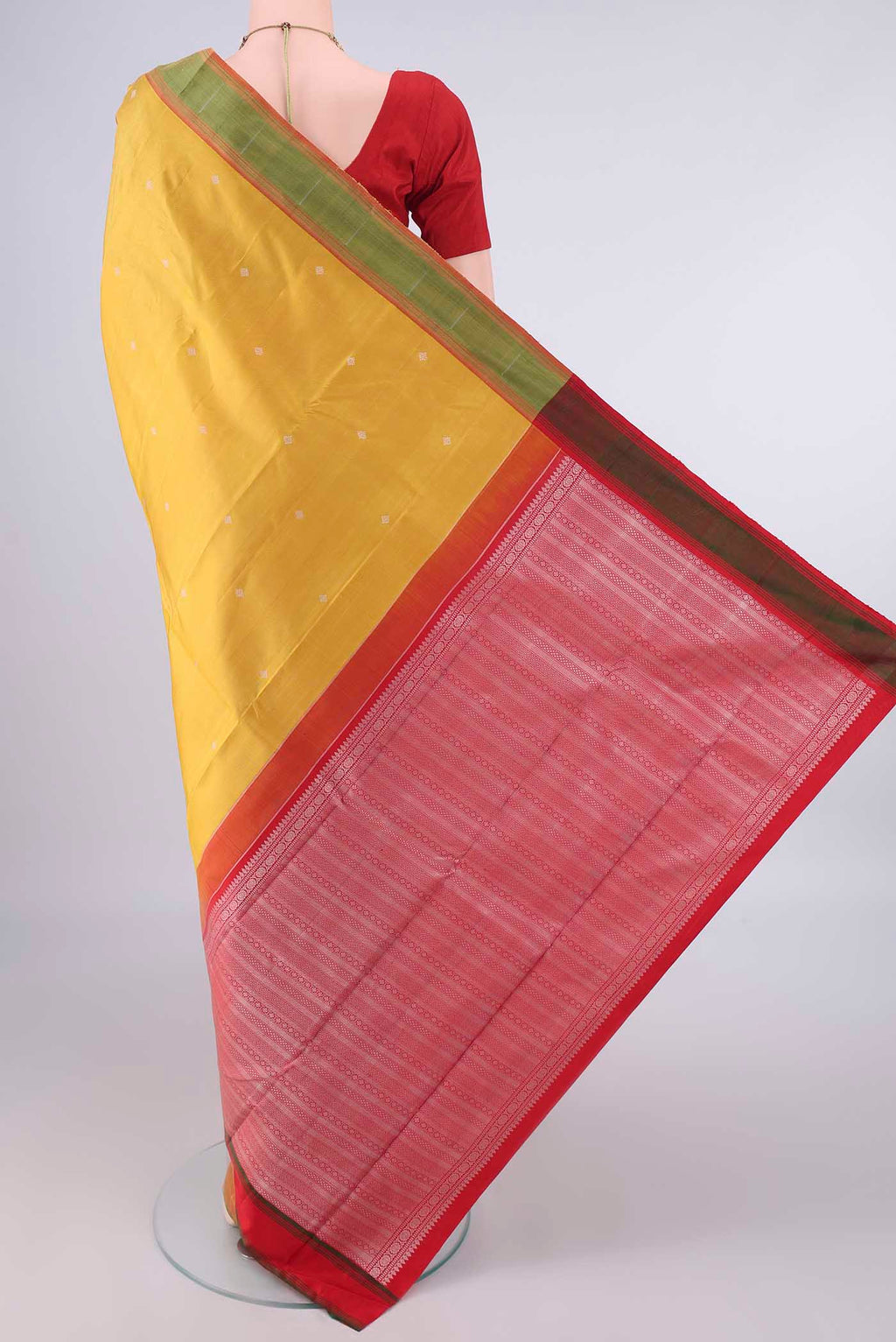 Flat view of Pure Silk Mustard Kanchipuram Saree with Thread Butta on the body and Plain Border. 